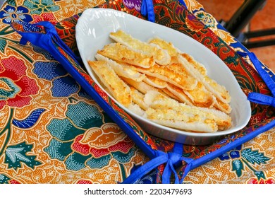 Brazilian Food: Crunchy Beiju, Type Of Dry Pancake Made From Manioc Starch, With Butter And Cheese, On Table With Colorful Tablecloth