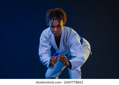 Brazilian girl Jujutsu fighter is ready for the Jiu Jitsu wrestling competition. Brazilian sport ju-jitsu. Mixed martial arts. - Powered by Shutterstock