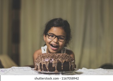 brazilian kid mesmerized by his chocolate cake
