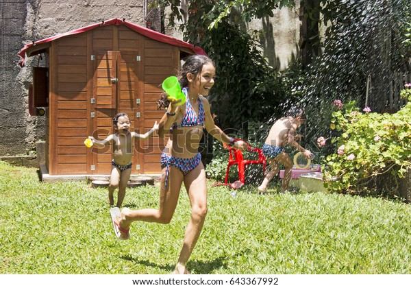 little purenudism family brazil Young Brazilian Girls Play On A Beach In Brazil Stock Video ...