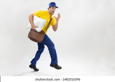Brazilian mailman running with a package on a white background. copy space.