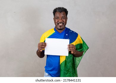 Brazilian Male Supporter Holding Blank Scoreboard With Free Space For Text