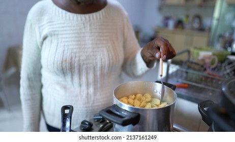 A Brazilian Older Person Cooking At Home A Senior Black Woman Preparing Food