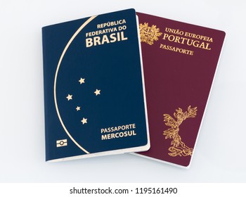 Brazilian passport (Translation "Brazil Republic federal mercosul passport") and portuguese passport (Translation "European Union Portugal passport") white background.
