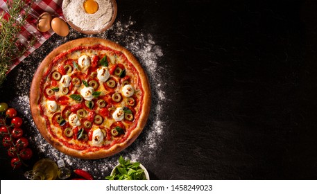 Brazilian Pizza With Tomato, Cream Cheese, Olive And Basil. Top View On Black Concrete Background, Close Up. Traditional Brazilian Pizza