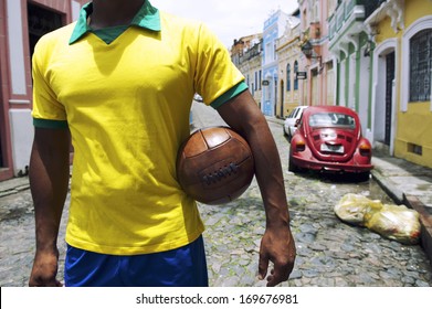 Brazilian Soccer Player Standing On Colonial Bahia Street Pelourinho Salvador With Vintage Football