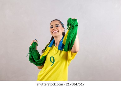 Brazilian Supporter. Brazilian Woman Fan Celebrating On Soccer Or Football Match On Grey Background. Brazil Colors.