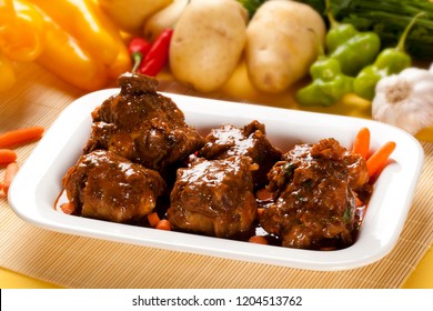 Brazilian Traditional Food Called Oxtail With Vegetables In Background.