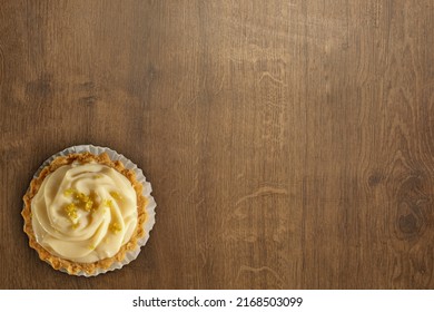 Brazilian Traditional Lemon Mousse Pie, On Wooden Surface. Flat Lay Top View With Text Area, Or Copy Space