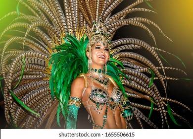 Brazilian wearing Samba Costume. Beautiful Brazilian woman wearing colorful costume and smiling during Carnaval street parade in Brazil.