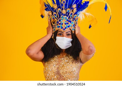 Brazilian wearing Samba Costume. Flu epidemic, protection against virus. Covid-19, coronavirus, carnival concep