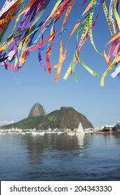 Brazilian wish ribbons flying above scenic view of Sugarloaf Mountain and Botafogo Bay