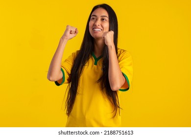 Brazilian Woman Young Soccer Fan In Studio Photo With Brazil Shirt