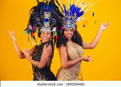 Brazilian women posing in carnival costume. 
