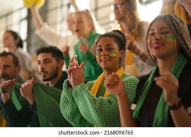 Brazilian young sisters football fans supporting their team at stadium. - Shutterstock ID 2168096765