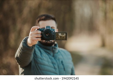 BRCKO, BOSNIA AND HERZEGOVINA - Mar 17, 2020: Man Holding Canon Camera With Articulating Screen In Park