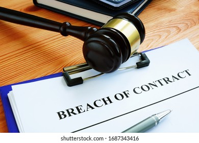 Breach Of Contract Papers With Pen And Gavel.