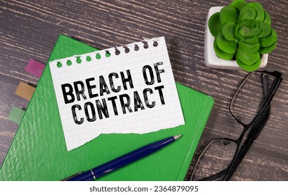 BREACH OF CONTRACT. text in notepad next to glasses on white background - Shutterstock ID 2364879095