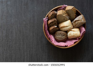 Bread With Acacia Bowl On Black Wooden Table