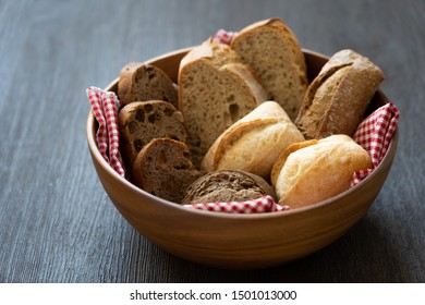 Bread With Acacia Bowl On Black Wooden Table