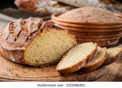 Bread. Baked bread. Craft bakery. Sliced bread on a wooden background. Food blog, food, pastries, flour, hot, fragrant, morning, fresh bread