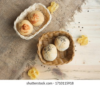 Bread in a basket on a light background.