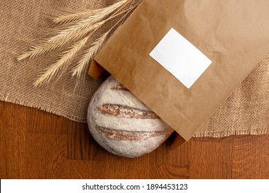 Bread In The Blank Paper Bag With Label, Bakery Branding Mockup, Empty Space To Display Your Logo Or Design.