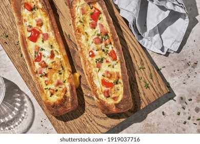 Bread Boats Stuffed With Ham, Egg, Green Onion And Cheese For Breakfast