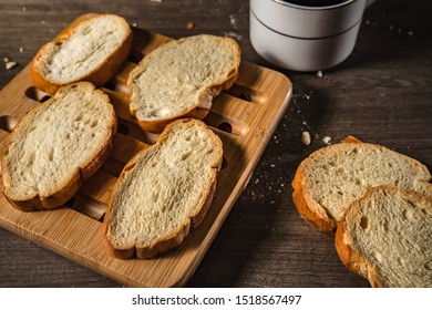 bread for breakfast, with cup of coffee over rustic wooden background with copy space. Morning breakfast with coffee and toasts. - Shutterstock ID 1518567497
