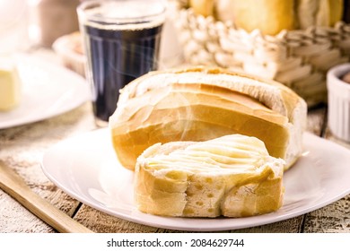 bread with butter and black coffee. Brazilian typical French bread with strong coffee cup, punctual focus on the toasted slice