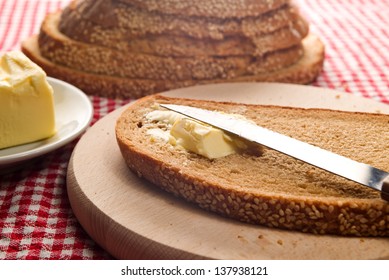 Bread and butter on a table, served for breakfast