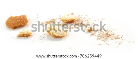 Bread crumbs macro isolated on white background, selective focus