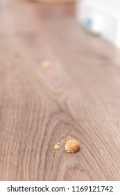 Bread Crumbs On A Wooden Floor