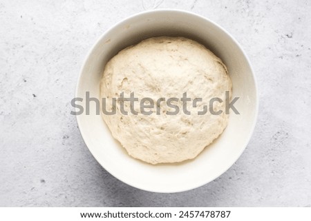 Similar – Image, Stock Photo The bread dough has risen nicely in the proofing basket
