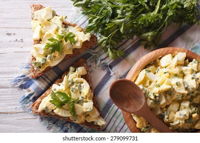 Bread And Egg Salad With Herbs And Mayonnaise Close-up. Horizontal View From Above 