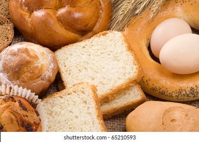 bread, eggs, buns in pot and spike on sacking