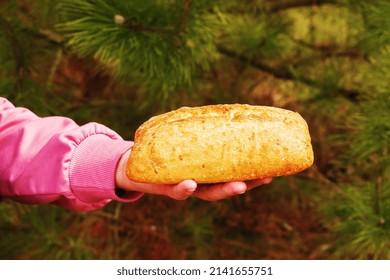 Bread In The Hand Of A Middle-aged Woman. The Concept Of The World Food Crisis Associated With The War In Ukraine.