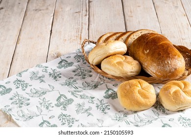 Bread, loaf, kaiser rolls on old white wooden table, healthy concept, bakery products