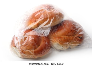 Bread Loaf In The Plastic Bag Isolated On White Background