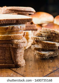 Bread. Bread Loafs, Rolls, Baguettes, Bagels, Slices Of Fresh Homemade Bread. Traditional Classic Bakery Goods. Made From Scratch In A Bakery By A Baker. 