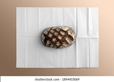 Bread on blank wrapping paper, bakery branding mockup, empty space to display your logo or design.