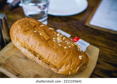 Bread On The Wood Plate With Almond In Sydney Restaurant