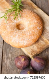 bread on a wooden board, figs and rosemary

 - Shutterstock ID 722599630