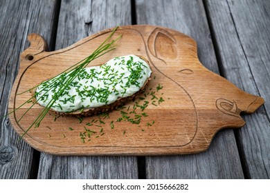 Bread With Quark And Chives On The Rustic Wood Board