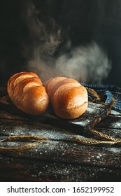 Bread recently removed from the oven and steamed on a rustic background - Shutterstock ID 1652199952