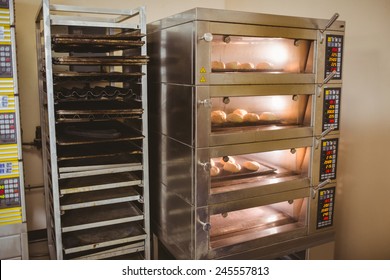 Bread Rolls Baking In Oven In A Commercial Kitchen