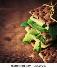 Bread Sandwiches With Cheese, Avocado And Fresh Arugula  - Healthy Eating Concept