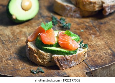Bread With Slices Avocado. Fresh Salmon And Spices