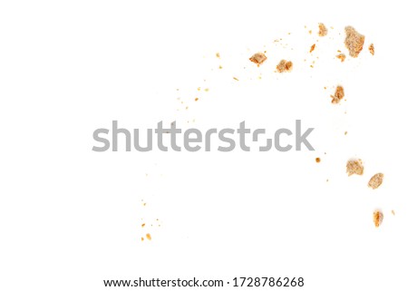 Bread slices and crumbs isolated on white background. Top view
