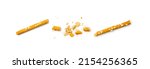 Bread sticks isolated. Crumbled, broken pretzel sticks, straws pieces, sesame grissini, pretzels snack, breadstick crumbs, with sesame seeds, long rusks on white background